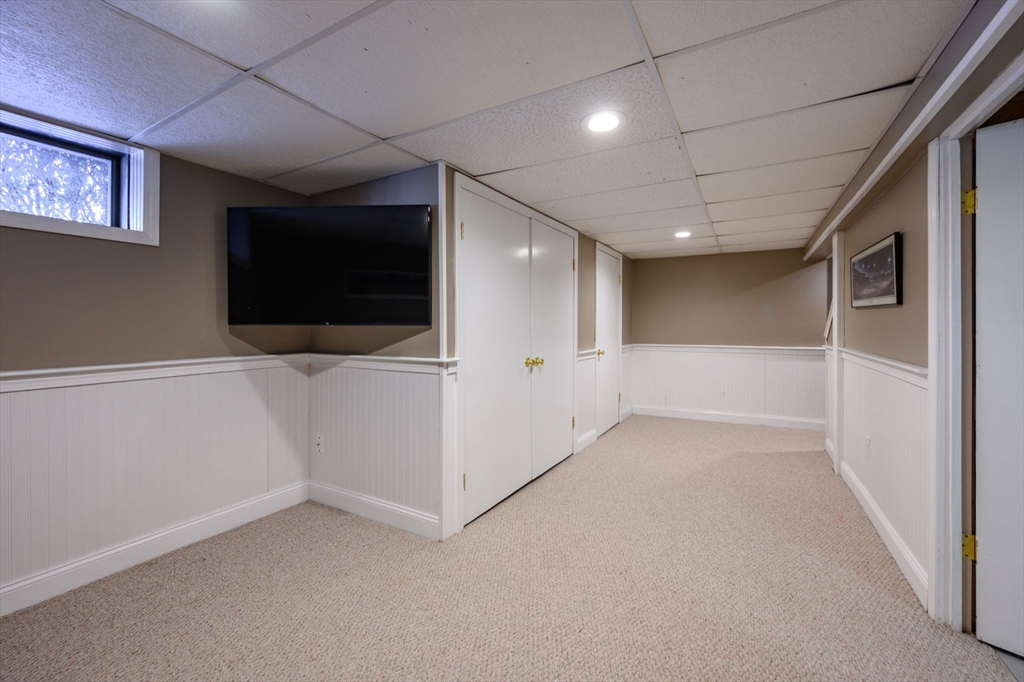 7 Village Lane Hingham, MA 02043 - Photo 26 of 34 a view of empty room with flat screen tv