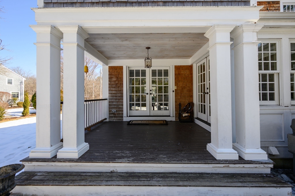 7 Village Lane Hingham, MA 02043 - Photo 28 of 34 a view of a hall with wooden floor and a window