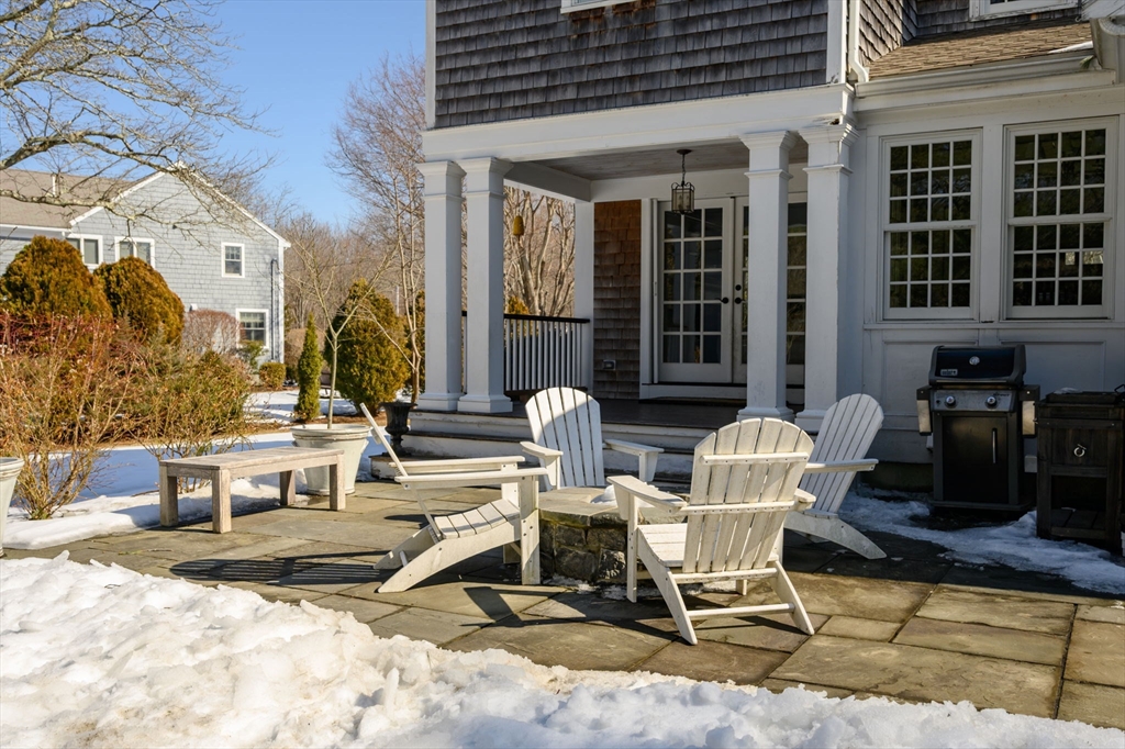 7 Village Lane Hingham, MA 02043 - Photo 29 of 34 a view of a patio with table and chairs