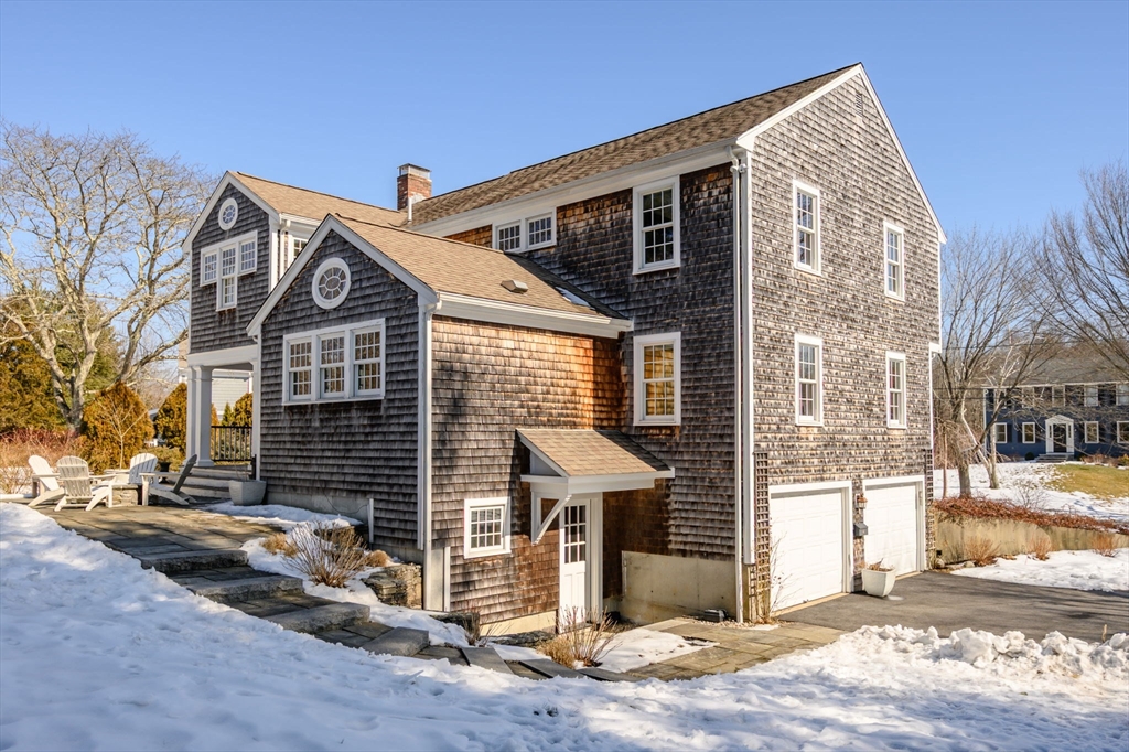 7 Village Lane Hingham, MA 02043 - Photo 33 of 34 a front view of a house with a garage