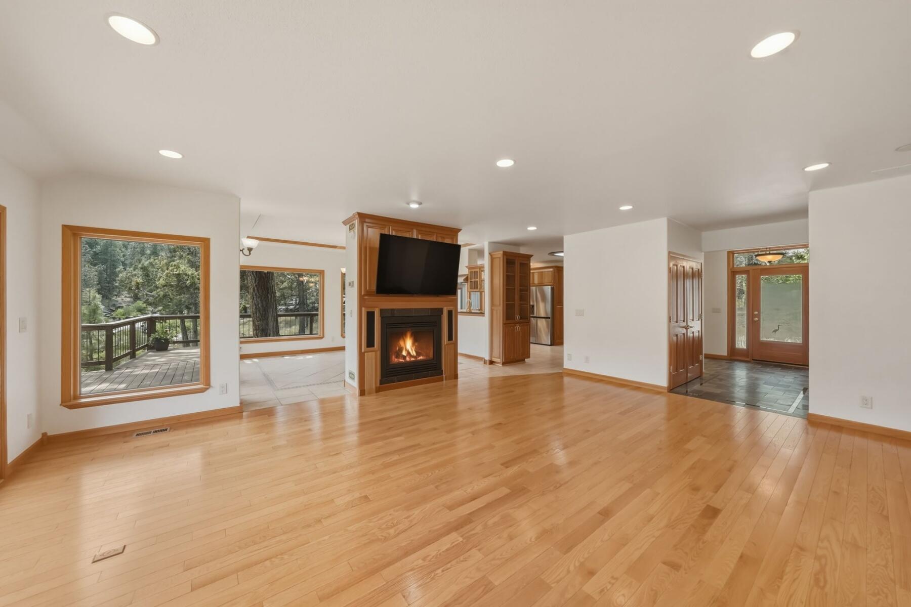 637 Northwest Silver Buckle Road Bend, OR 97703 - Photo 9 of 68 a view of an empty room with a kitchen and a window