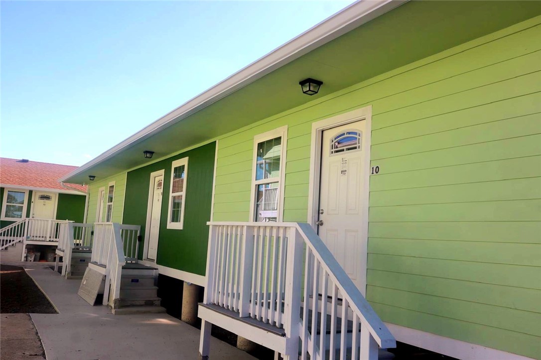 868 Gonzales Street, Unit 7 Robstown, TX 78380 - Photo 1 of 7 a view of a porch with furniture and a yard
