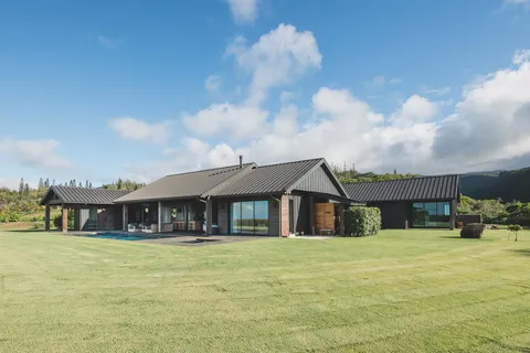 a front view of a house with swimming pool