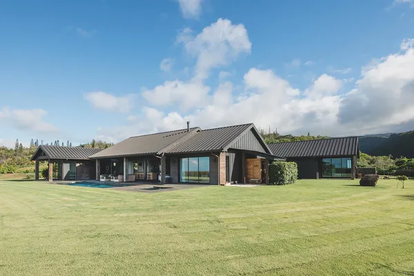 a front view of a house with swimming pool