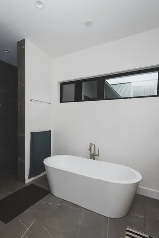 a view of front door with wooden floor