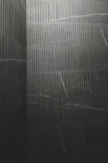 a bedroom with a bed and a potted plant