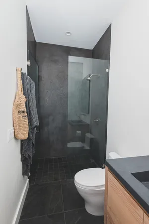 a kitchen with granite countertop lots of clutter and cabinets