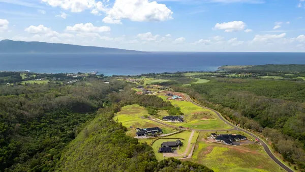 a view of a kitchen with wooden floor