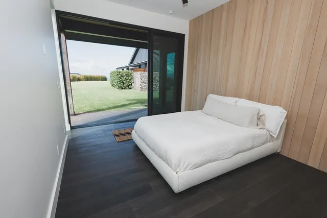 a view of a field with an ocean