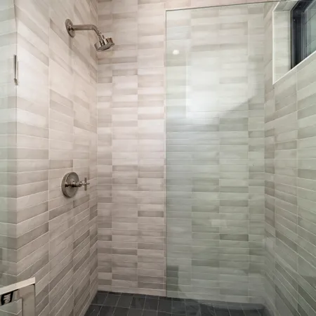 a view of living room kitchen with stainless steel appliances cabinets