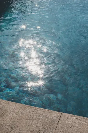 a view of a house with a big yard and large trees