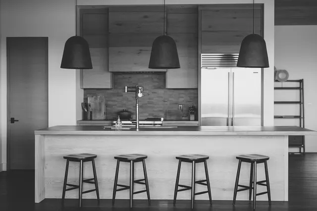 a kitchen with a sink and cabinets