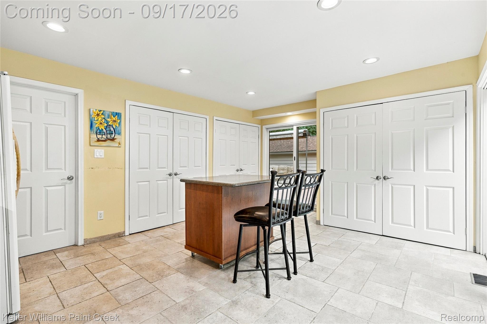 4535 Orion Road Rochester, MI 48306 - Photo 30 of 67 Recessed lighting, wood-finish kitchen island with stone countertop, tile flooring, and multiple paneled doors