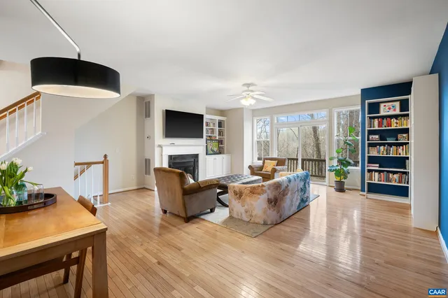 a living room with furniture fireplace and a flat screen tv