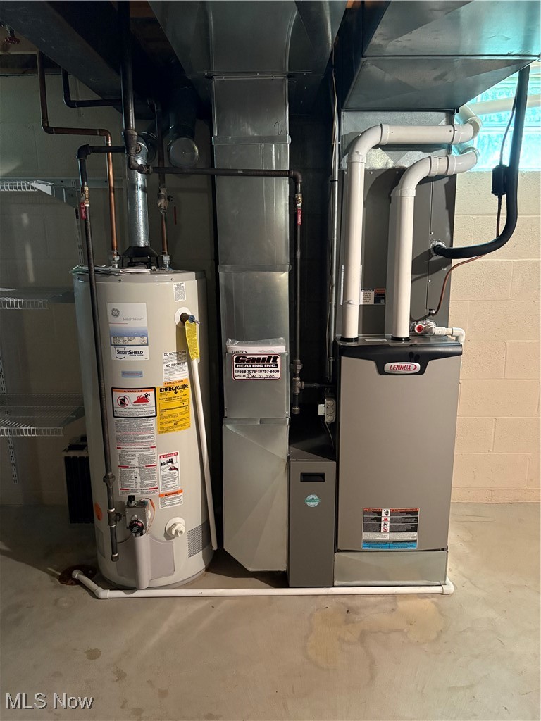 6695 Clingan Road, Unit 24 Youngstown, OH 44514 - Photo 21 of 26 Utilities featuring gas water heater and heating unit