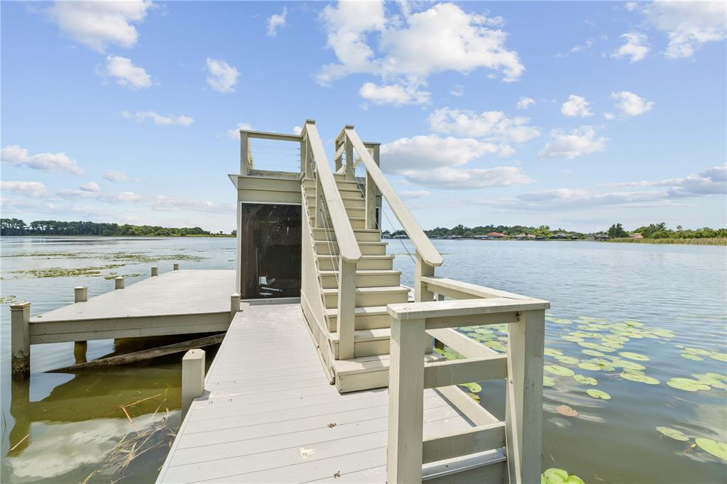 16948 Deer Island Road Tavares, FL 32778 - Photo 63 of 67 a front view of a house with lake view and a ocean view