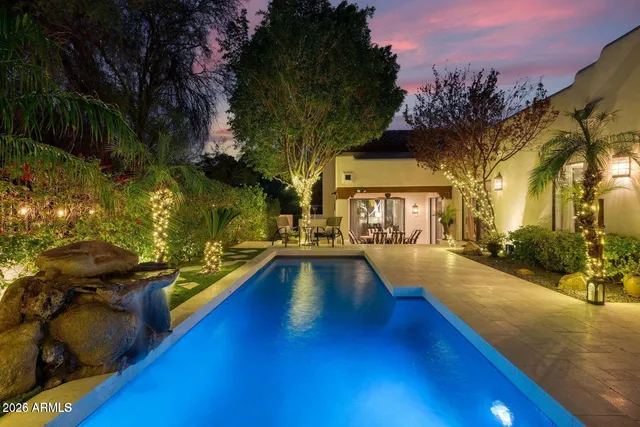 a view of a swimming pool with a lounge chairs