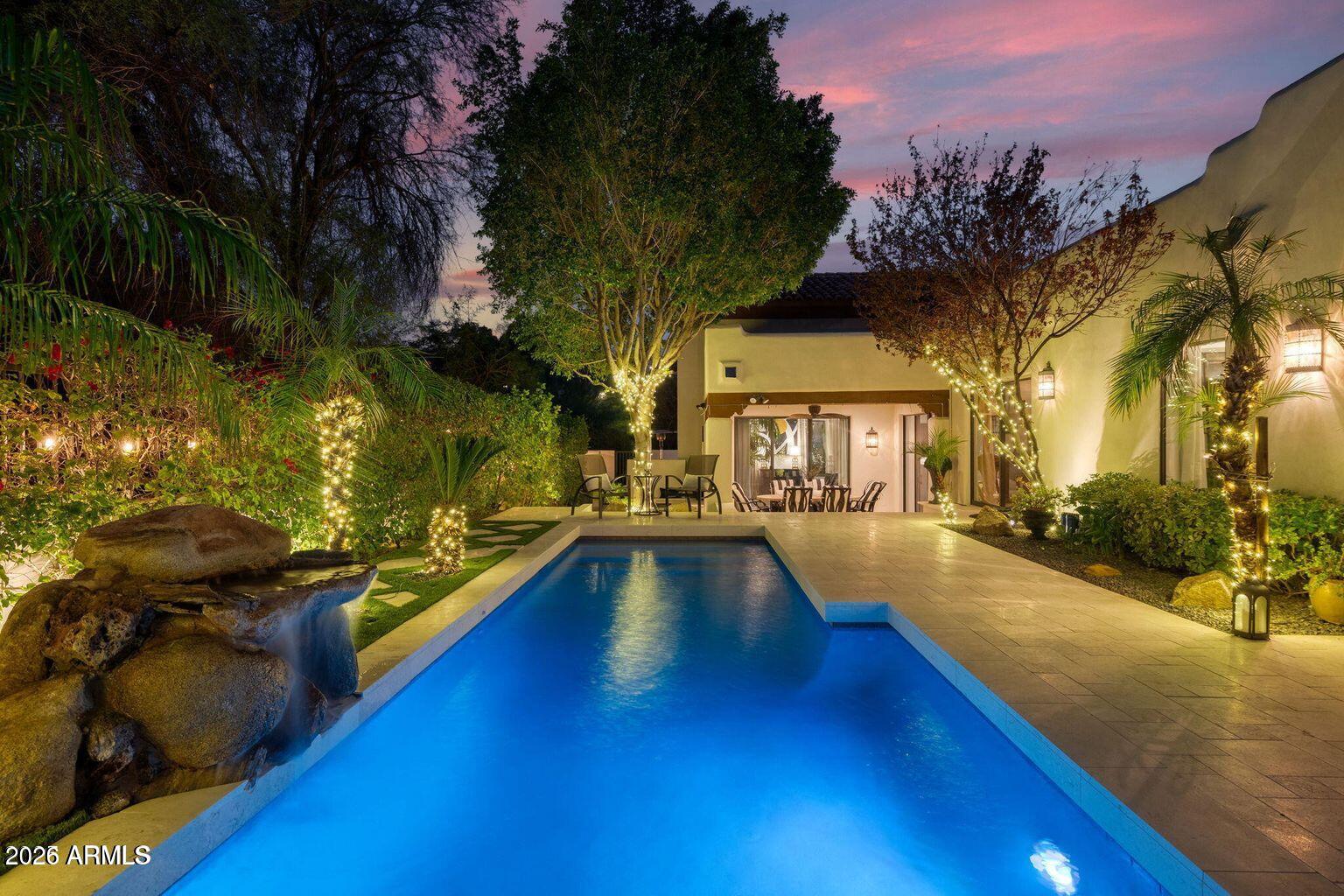 a view of a swimming pool with a lounge chairs