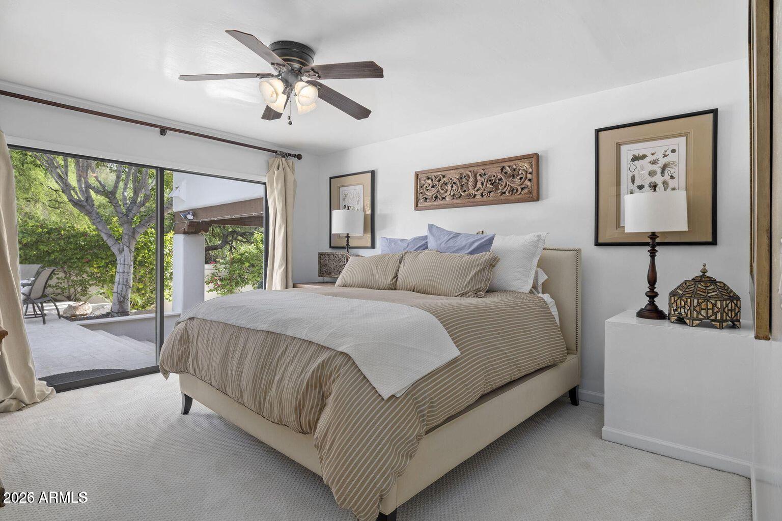 6198 North 28th Place Phoenix, AZ 85016 - Photo 13 of 21 a bed sitting in a spacious bedroom next to a window