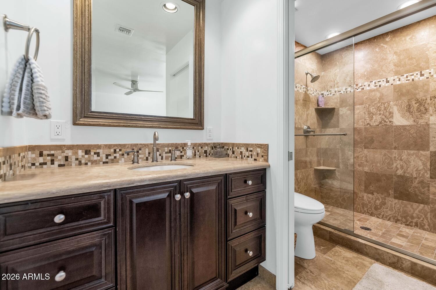 6198 North 28th Place Phoenix, AZ 85016 - Photo 17 of 33 a bathroom with a sink and a mirror