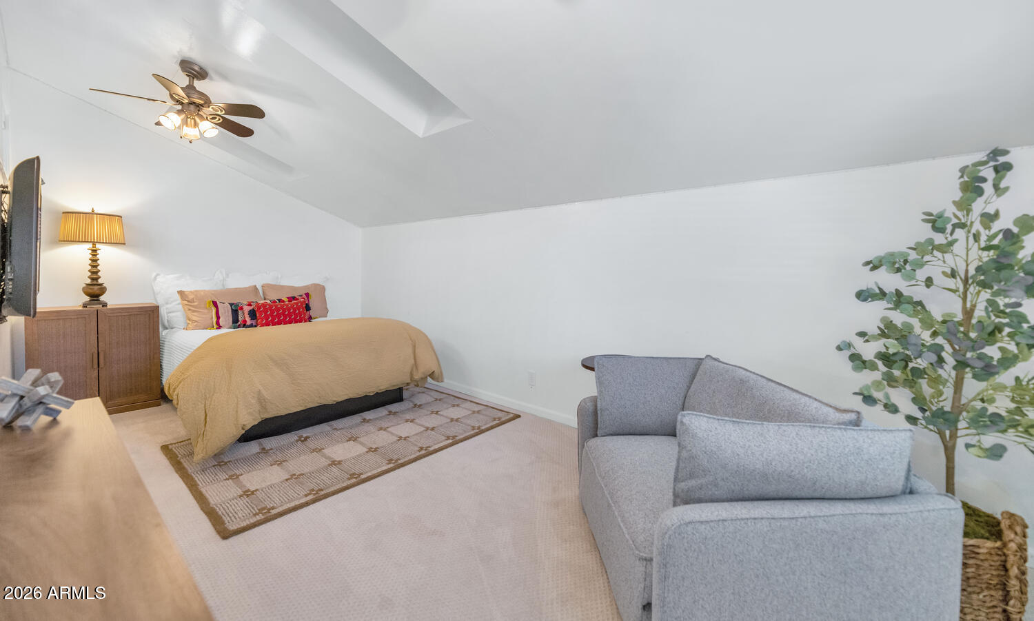6198 North 28th Place Phoenix, AZ 85016 - Photo 18 of 33 a bedroom with a bed and a potted plant on table