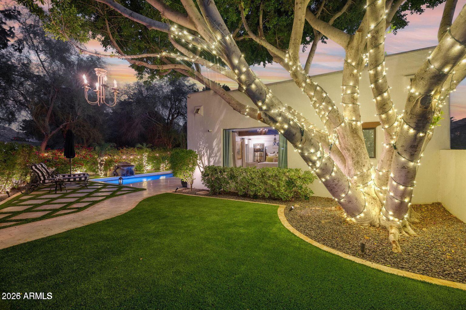 6198 North 28th Place Phoenix, AZ 85016 - Photo 19 of 21 a view of a fountain in front of house