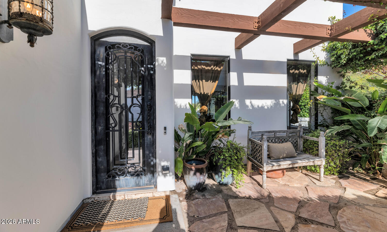 6198 North 28th Place Phoenix, AZ 85016 - Photo 2 of 33 a potted plant sitting in front of a door