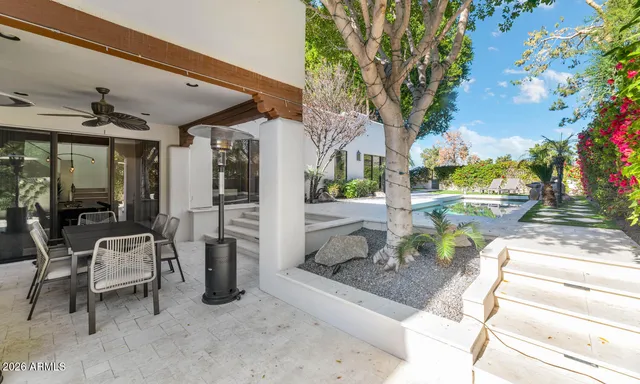 a view of living room kitchen with furniture and outdoor seating