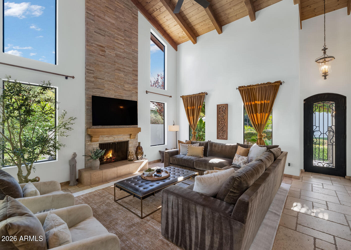 6198 North 28th Place Phoenix, AZ 85016 - Photo 3 of 33 a living room with furniture fireplace and potted plants