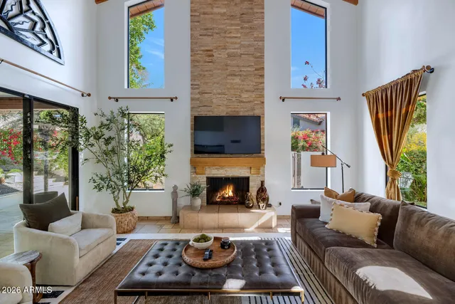 a living room with furniture fireplace and a fireplace
