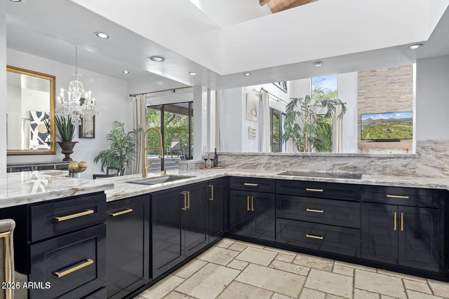 6198 North 28th Place Phoenix, AZ 85016 - Photo 7 of 21 a kitchen with a sink and large window