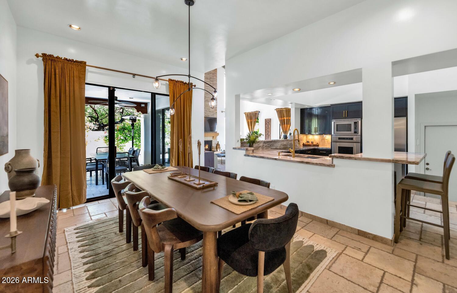 6198 North 28th Place Phoenix, AZ 85016 - Photo 7 of 33 a view of a dining room with furniture window and outside view