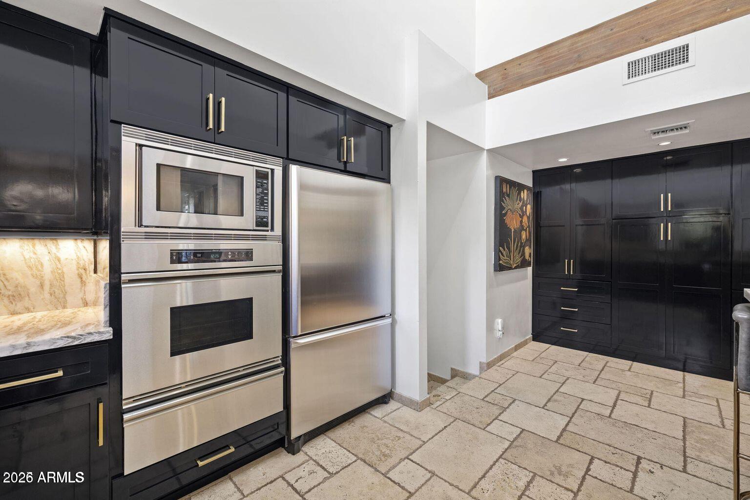 6198 North 28th Place Phoenix, AZ 85016 - Photo 8 of 21 a kitchen with granite countertop a refrigerator and a stove