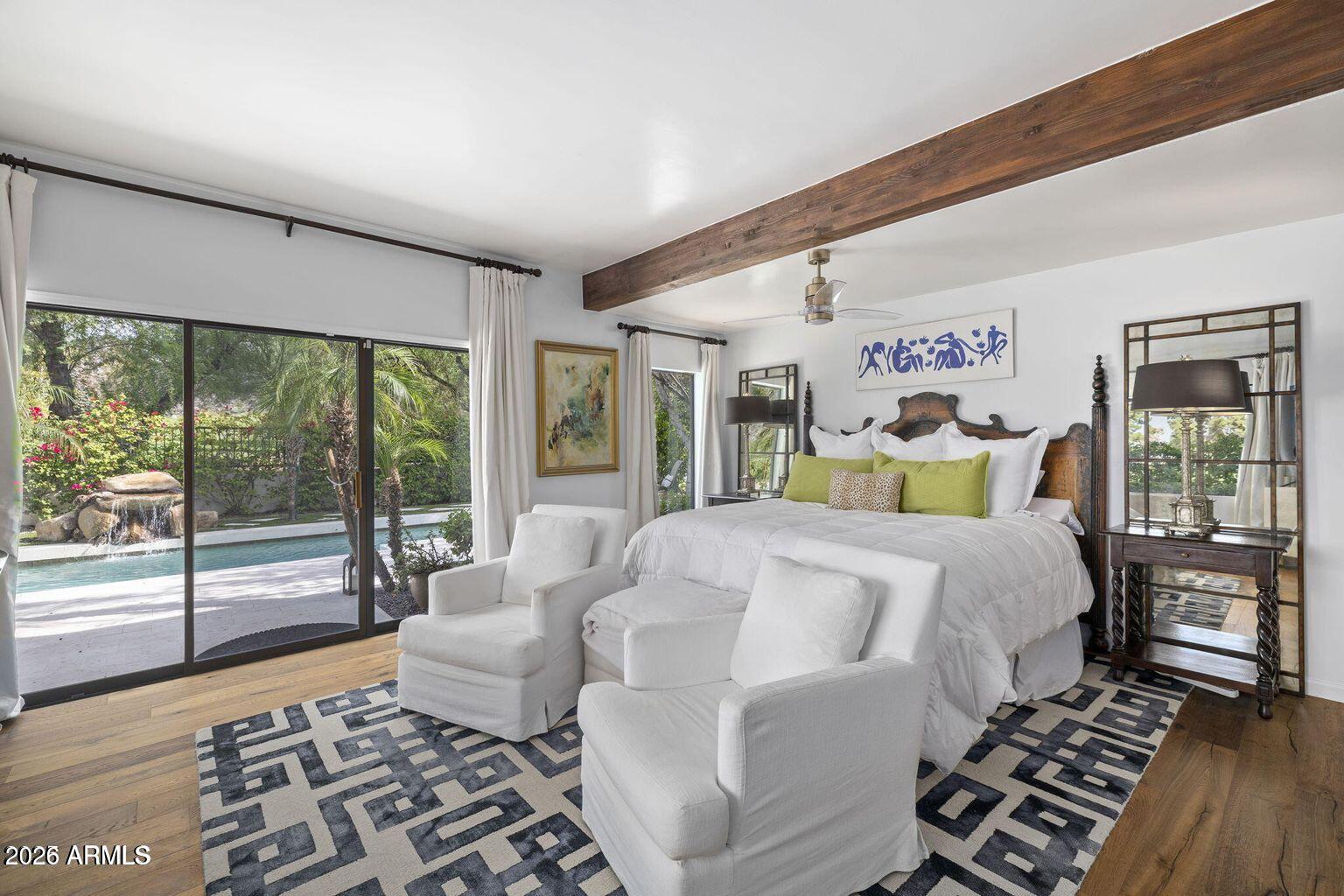 6198 North 28th Place Phoenix, AZ 85016 - Photo 9 of 21 a bedroom with a bed and wooden floor