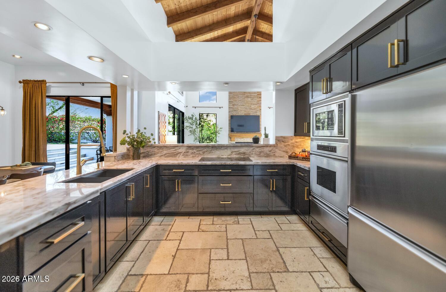 6198 North 28th Place Phoenix, AZ 85016 - Photo 10 of 33 a kitchen with a sink stove and refrigerator