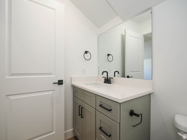 3938 North Wood Road Eagle Mountain, UT 84005 - Photo 41 of 55 Bathroom featuring vanity and toilet