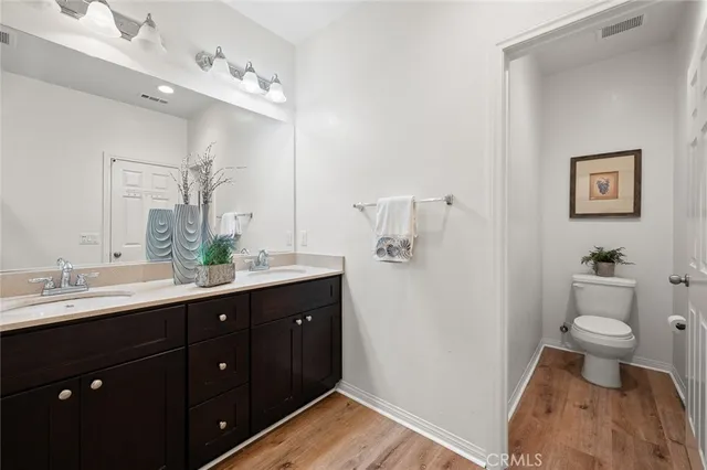 an empty room with a window and a wooden floor