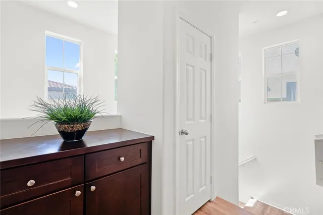a kitchen with granite countertop cabinets stainless steel appliances and a dining table