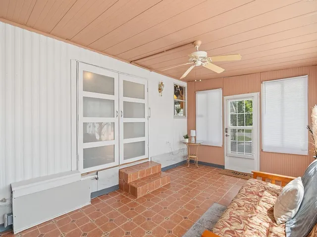 a bedroom with furniture and windows