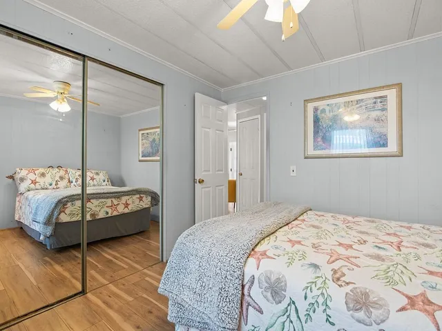 a bedroom with a bed and a view of bathroom