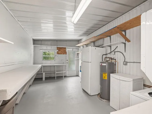 a view of storage and utility room with washer and dryer