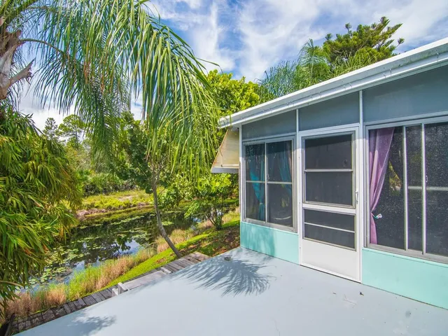 a view of front door and yard