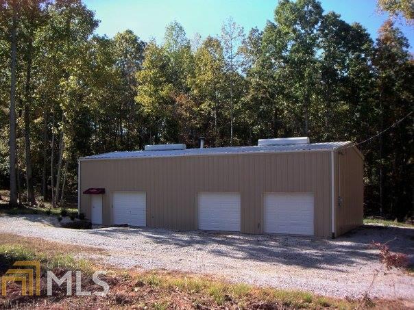 3218 Macedonia Road Franklin, GA 30217 - Photo 1 of 1 a backyard of a house with lots of green space