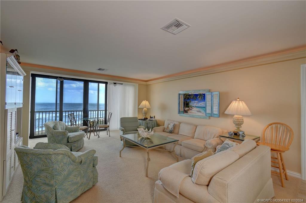 2375 Northeast Ocean Boulevard, Unit E405 Stuart, FL 34996 - Photo 13 of 58 a living room with furniture and a large window