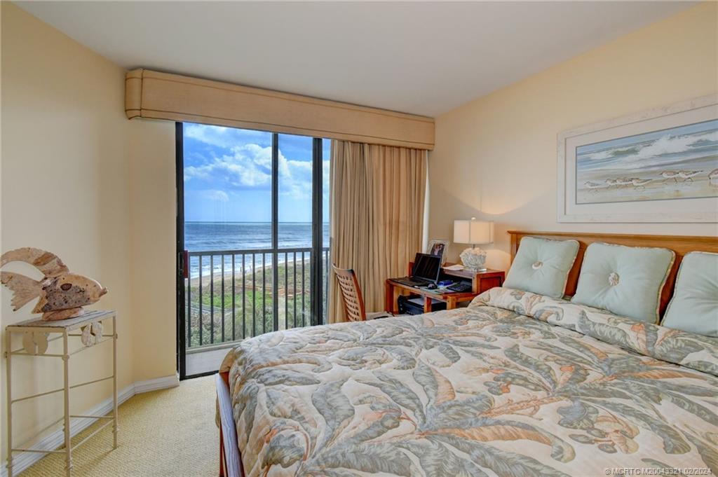 2375 Northeast Ocean Boulevard, Unit E405 Stuart, FL 34996 - Photo 20 of 58 a bedroom with a bed and a window