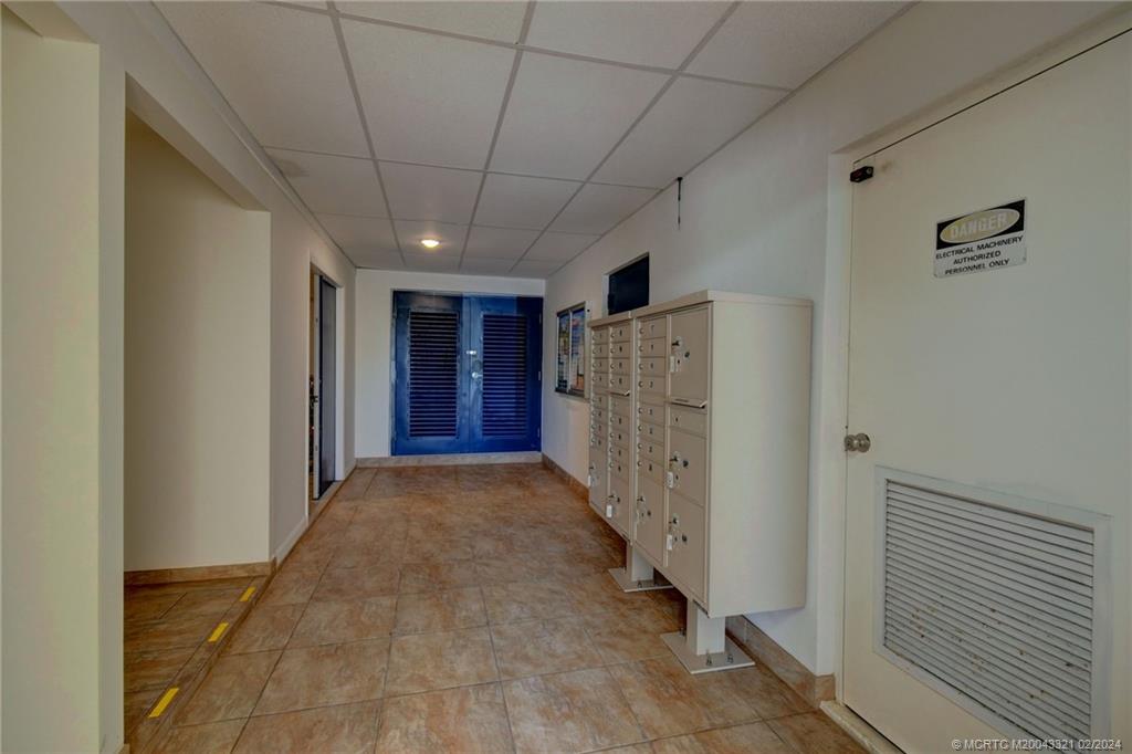 2375 Northeast Ocean Boulevard, Unit E405 Stuart, FL 34996 - Photo 34 of 58 a view of a hallway with wooden shelves