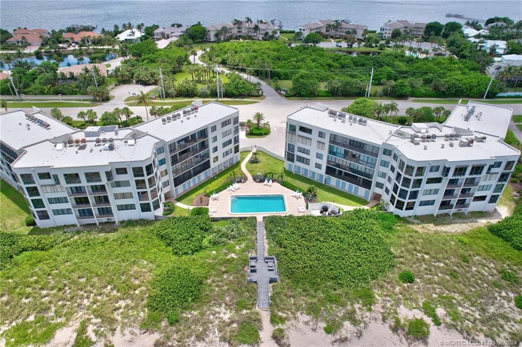2375 Northeast Ocean Boulevard, Unit E405 Stuart, FL 34996 - Photo 35 of 58 a aerial view of a house with a yard and potted plants