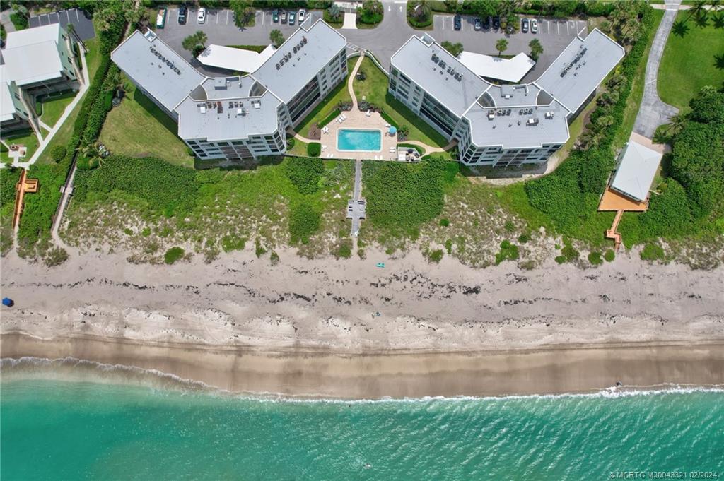 2375 Northeast Ocean Boulevard, Unit E405 Stuart, FL 34996 - Photo 50 of 58 a aerial view of a house with a garden and lake view