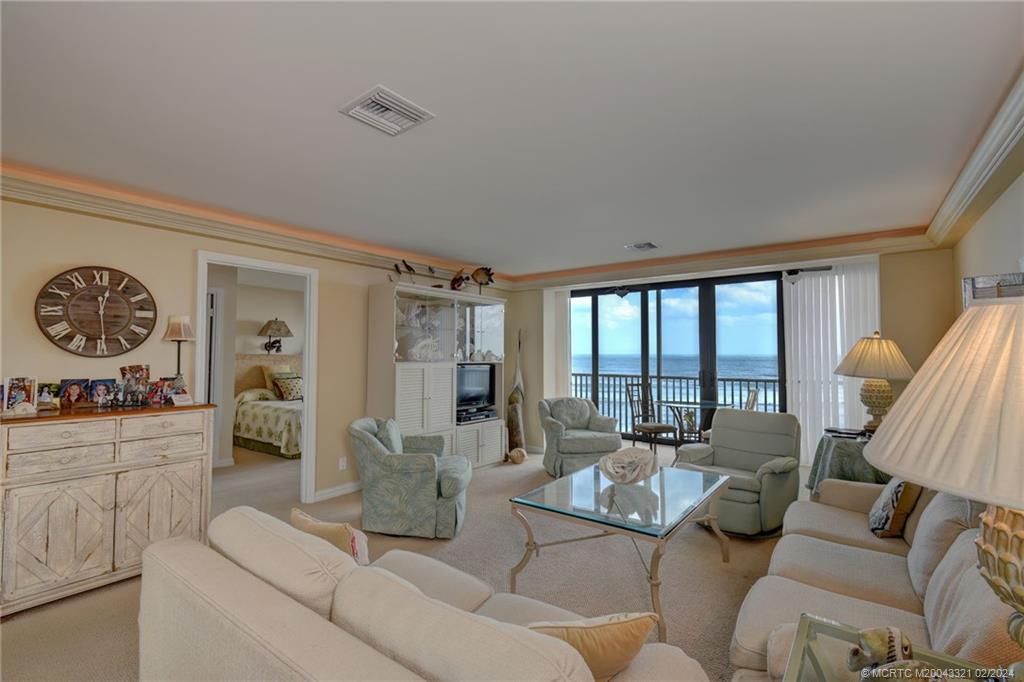 2375 Northeast Ocean Boulevard, Unit E405 Stuart, FL 34996 - Photo 10 of 58 a living room with furniture and a large window