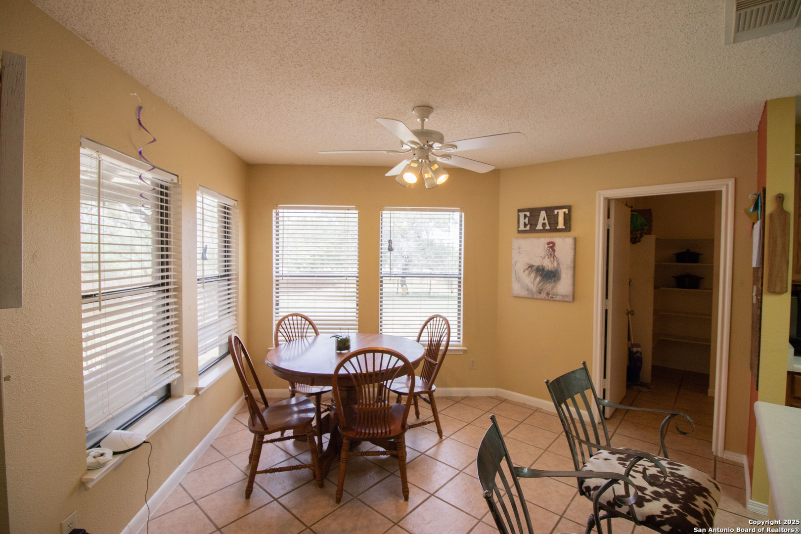 797 Killarney Road Floresville, TX 78114 - Photo 14 of 35 a view of a dining room with furniture window and outside view